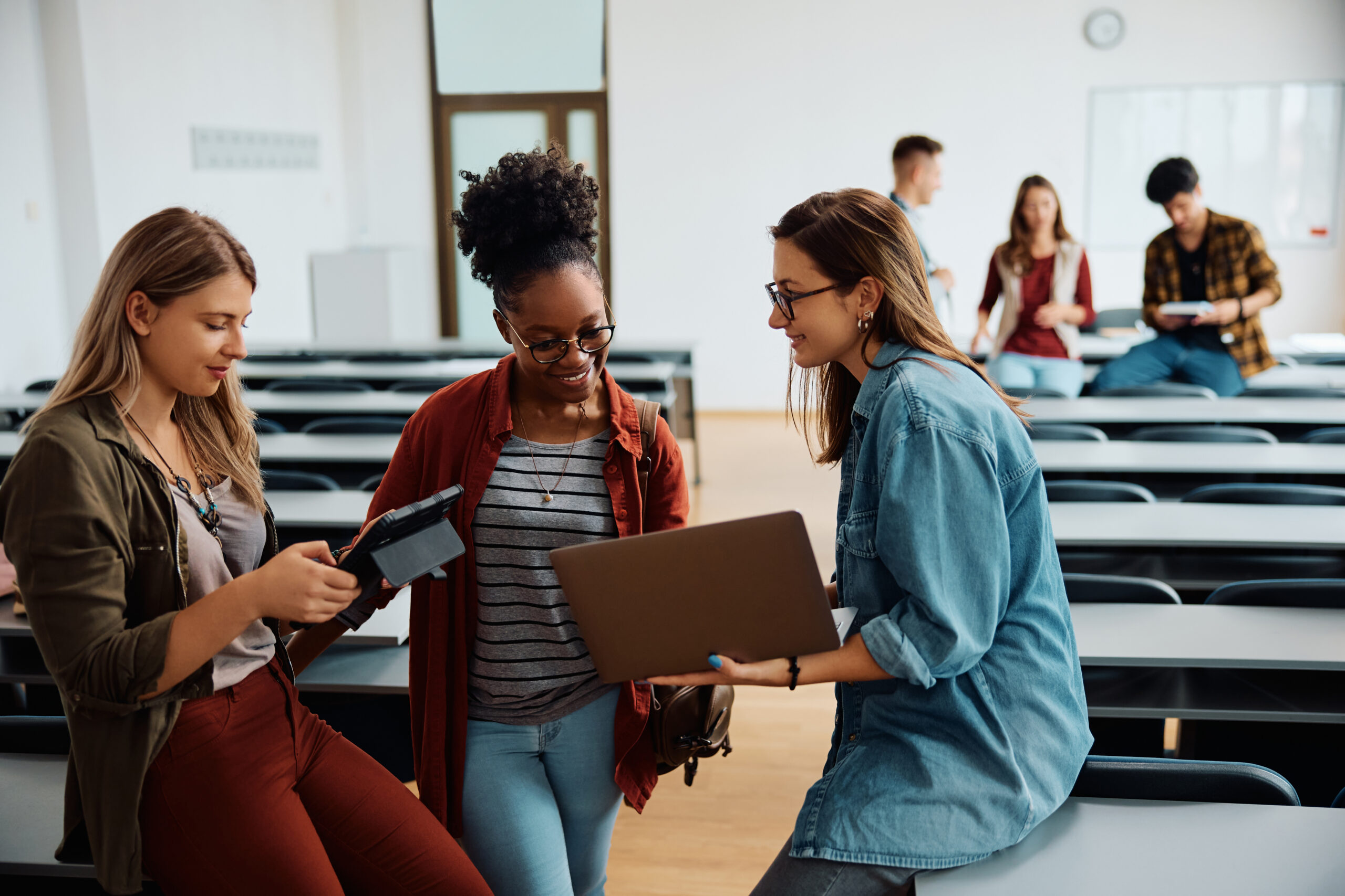 happy-female-students-using-wireless-technology-in-2024-12-13-19-05-47-utc