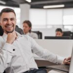 happy-male-investor-working-in-office-2022-12-01-18-11-48-utc-1024x683