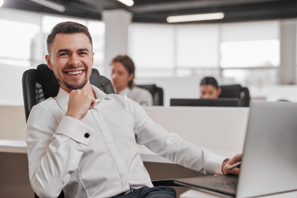 happy-male-investor-working-in-office-2022-12-01-18-11-48-utc-1024x683